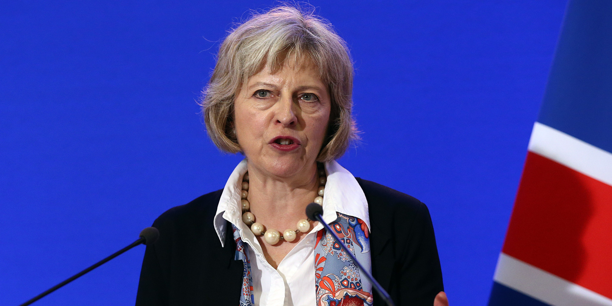 CALAIS, FRANCE - AUGUST 20:  Britain's Home Secretary Theresa May speaks to the media at a press conference after signing an agreement to tackle the migrant crisis in Calais on August 20, 2015 in Calais, France. The Home Secretary arrived in Calais to announce a number of measures to deal with the migrant issue in which about 3,000 migrants are thought to be camped in Calais hoping to cross the Channel into Britain. Measures include the creation of a joint command centre to target criminals trafficking migrants into France and the UK.  (Photo by Carl Court/Getty Images)
