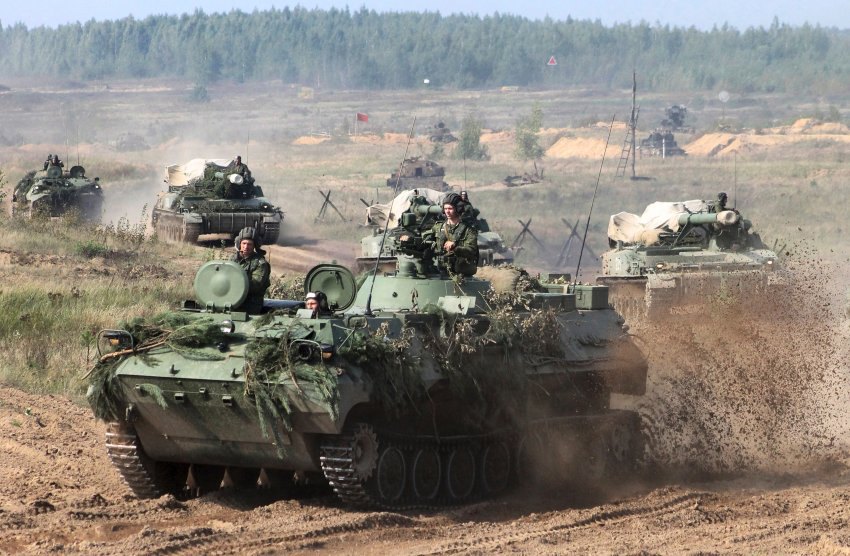 In this photo taken on Monday, Sept. 11, 2017, Belarusian army vehicles drive preparing for war games at an undisclosed location in Belarus. Russia and Belarus are holding a massive war games, Zapad 2017, that due to start on Thursday near the borders of Poland, Estonia, Latvia and Lithuania. (Vayar Military Agency photo via AP)